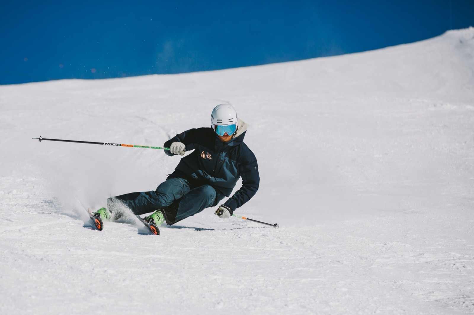 David mid-carve under a clear blue sky