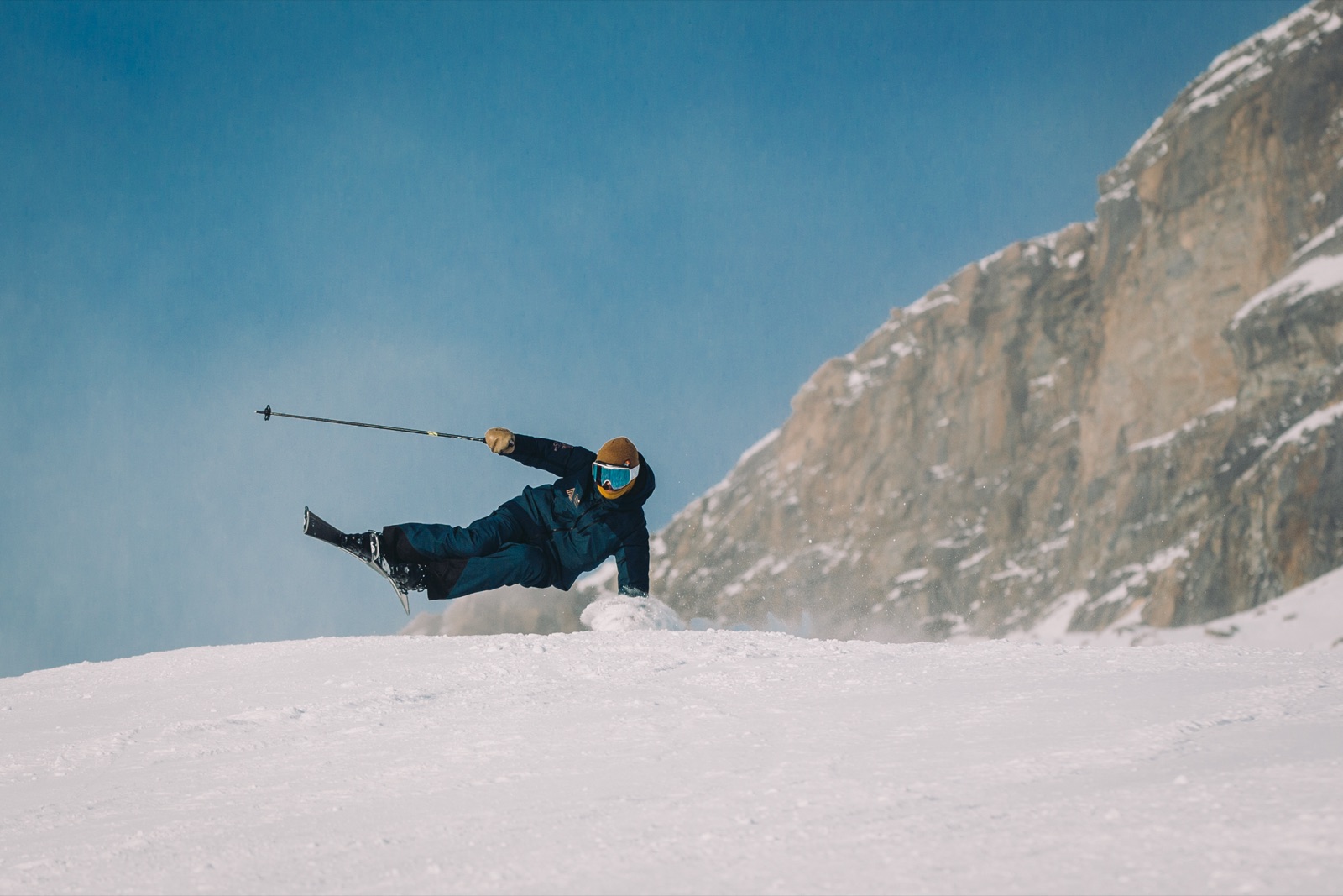 George airborne in front of an alpine face