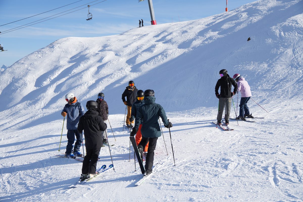 The cohort regrouping mid-lesson on the mountain